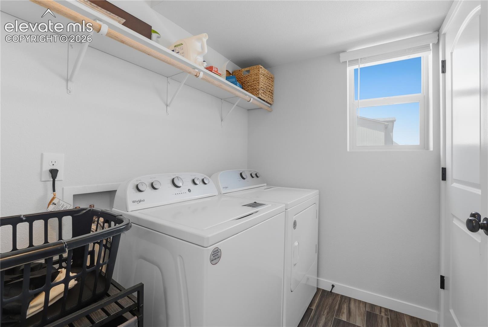 6008 Ashmore Road Colorado Springs, CO 80927 - Photo 32 of 48 Dedicated laundry space featuring wood-finish flooring, white walls, and a white window with a privacy blind
