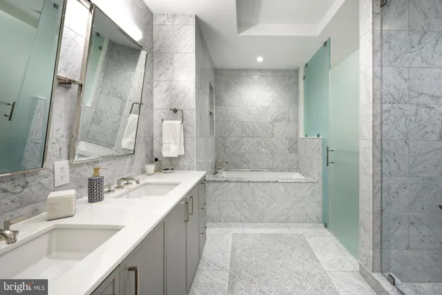 a bathroom with a bathtub and a sink