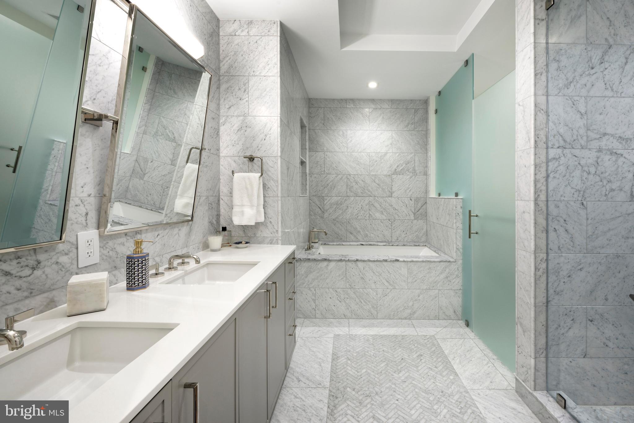 8551 Connecticut Avenue, Unit 207 Chevy Chase, MD 20815 - Photo 14 of 33 a bathroom with a bathtub and a sink