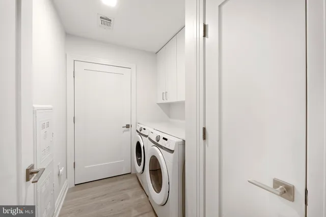 a view of a storage & utility room with washer and dryer