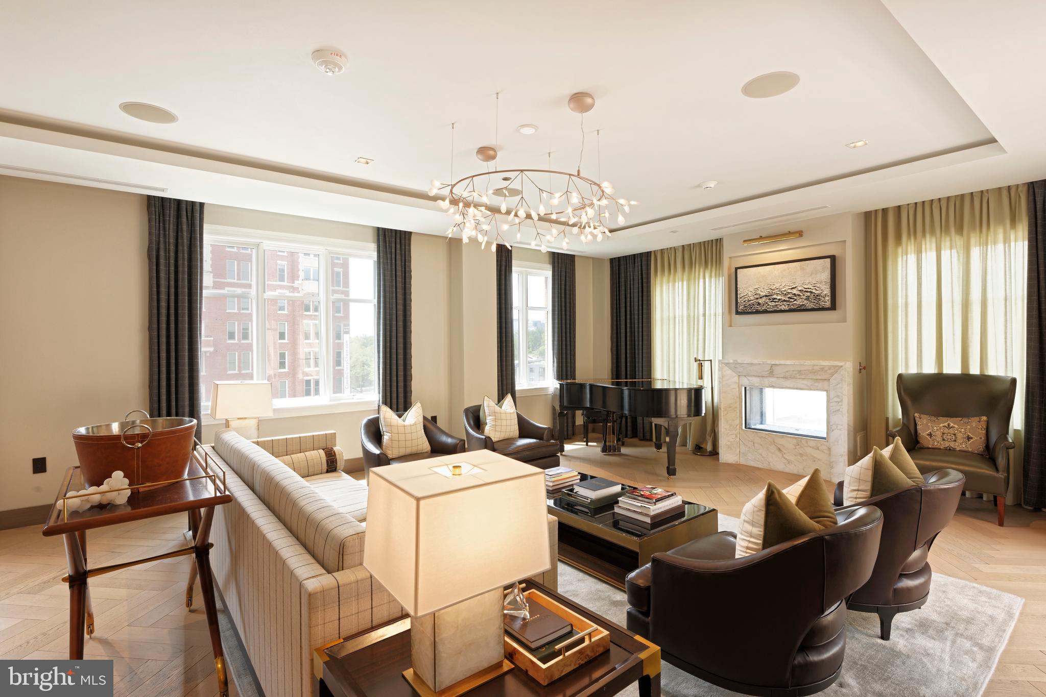 8551 Connecticut Avenue, Unit 207 Chevy Chase, MD 20815 - Photo 23 of 33 a living room with furniture and large windows