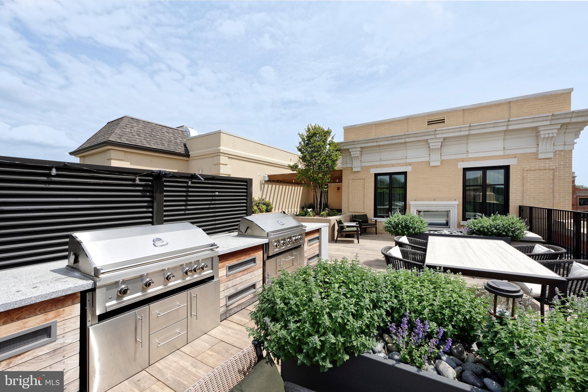 8551 Connecticut Avenue, Unit 207 Chevy Chase, MD 20815 - Photo 28 of 33 a view of a patio with chairs and potted plants