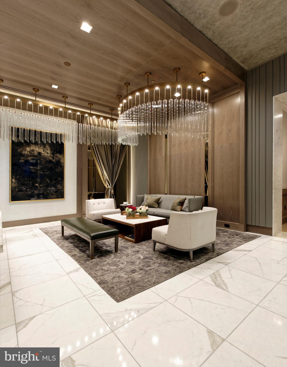 8551 Connecticut Avenue, Unit 207 Chevy Chase, MD 20815 - Photo 3 of 33 a outdoor space with lots of tables and a glass door shower