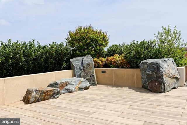 a wooden bench sitting on top of a wooden floor