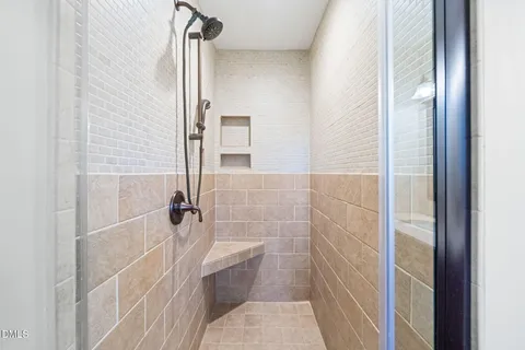 a bathroom with a sink mirror and a window