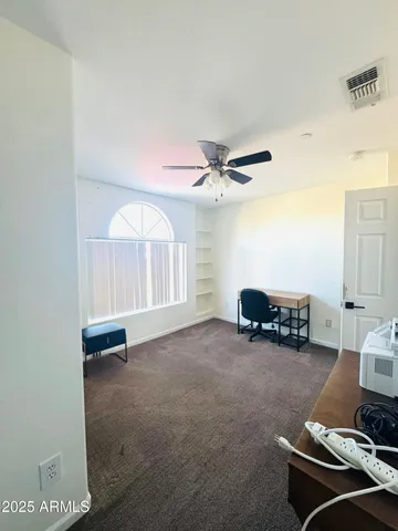 a view of livingroom with furniture and a window