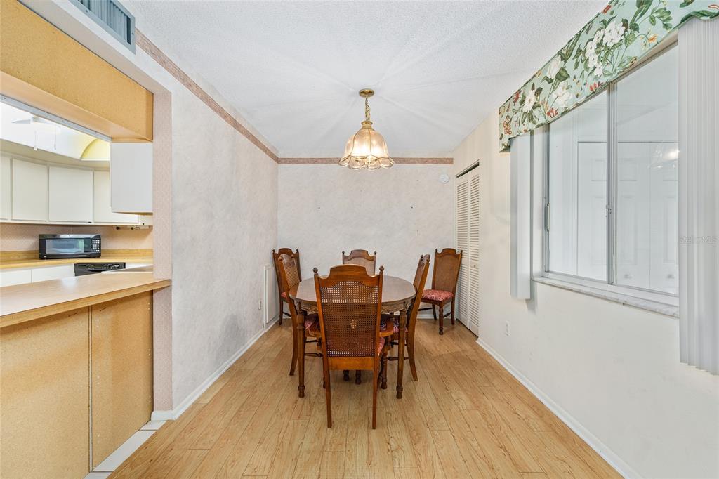 606 Midway Drive, Unit A Ocala, FL 34472 - Photo 11 of 27 a dining room with furniture and wooden floor
