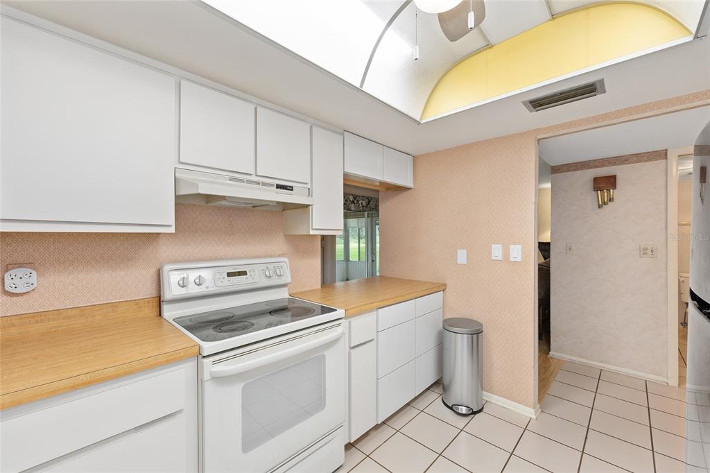 606 Midway Drive, Unit A Ocala, FL 34472 - Photo 13 of 27 a kitchen with a sink and cabinets