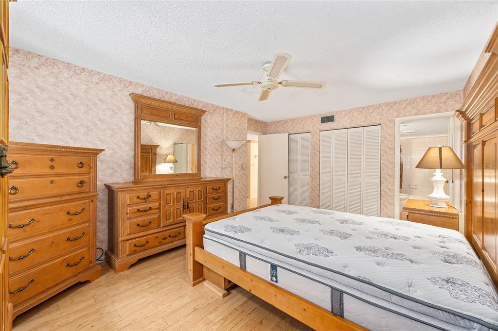 606 Midway Drive, Unit A Ocala, FL 34472 - Photo 15 of 27 a bedroom with a bed and a dresser