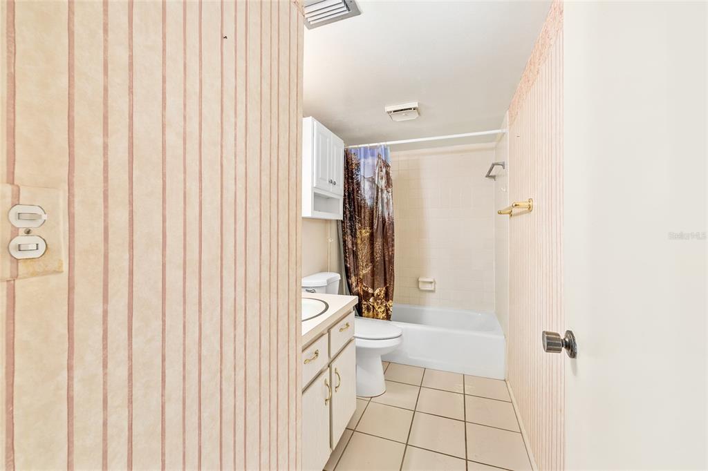 606 Midway Drive, Unit A Ocala, FL 34472 - Photo 16 of 27 a bathroom with a bathtub and a shower