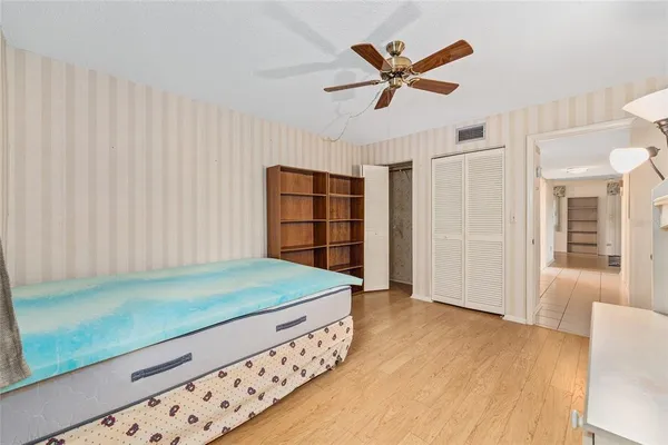 a bathroom with a toilet a sink and a mirror