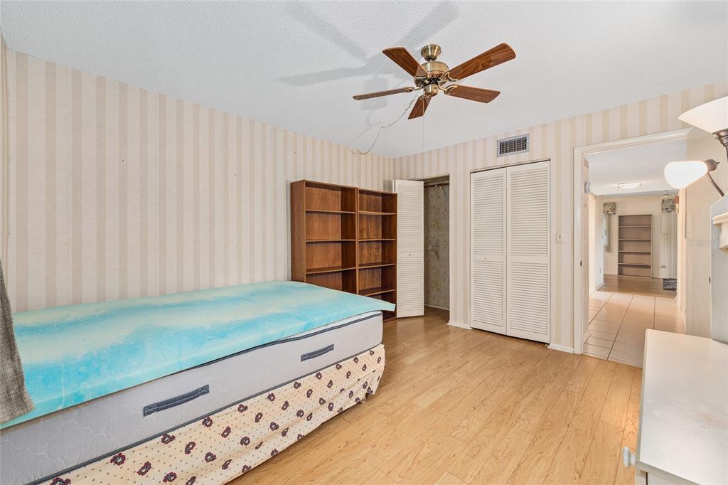 606 Midway Drive, Unit A Ocala, FL 34472 - Photo 18 of 27 a living room with a bed furniture and a window