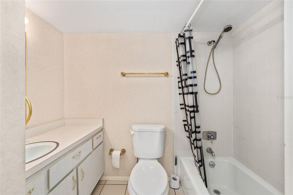 606 Midway Drive, Unit A Ocala, FL 34472 - Photo 19 of 27 a bathroom with a sink a toilet and shower