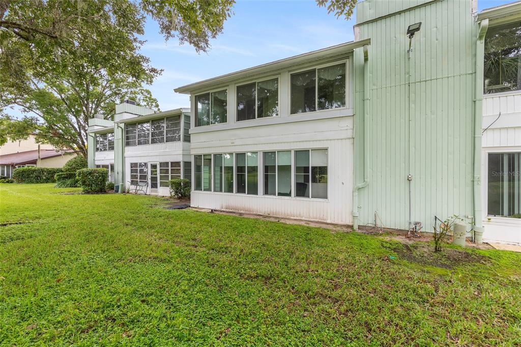 606 Midway Drive, Unit A Ocala, FL 34472 - Photo 26 of 27 a view of a house with yard and garden