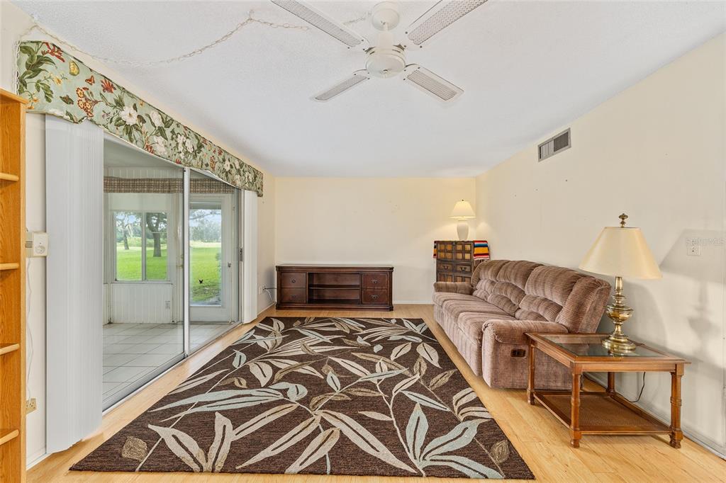 606 Midway Drive, Unit A Ocala, FL 34472 - Photo 7 of 27 a bedroom with a bed and glass window