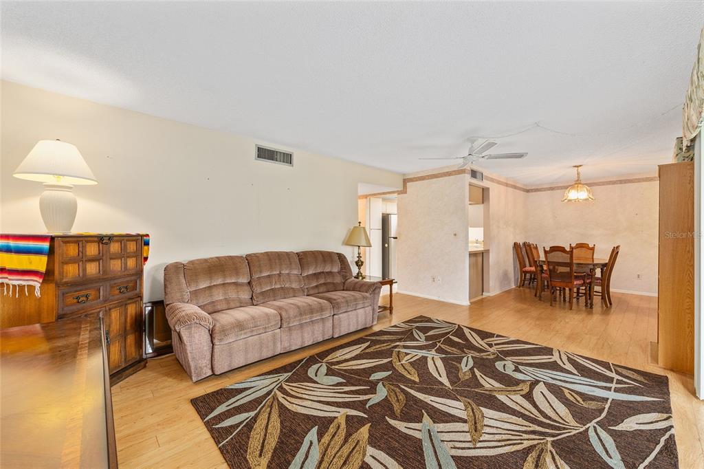 606 Midway Drive, Unit A Ocala, FL 34472 - Photo 9 of 27 a living room with furniture and a flat screen tv