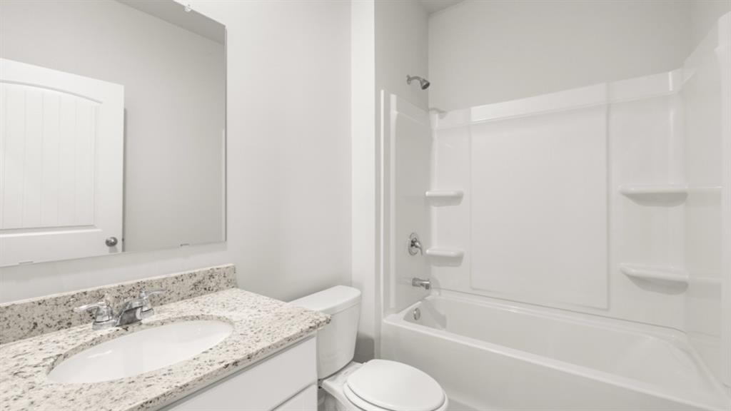 348 Belmont Drive Cartersville, GA 30120 - Photo 15 of 41 a bathroom with a granite countertop sink toilet and shower