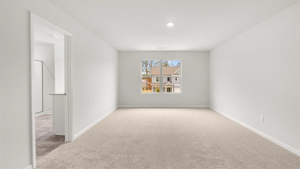348 Belmont Drive Cartersville, GA 30120 - Photo 19 of 41 an empty room with windows & cabinet