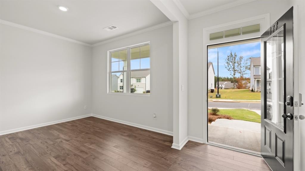 348 Belmont Drive Cartersville, GA 30120 - Photo 3 of 41 wooden floor in an empty room with a window
