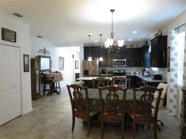 a view of a dining room and chandelier