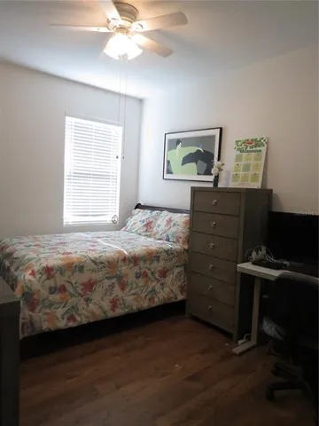 a bathroom with a sink mirror vanity and toilet