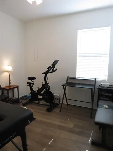 a bed sitting in a room next to a large window