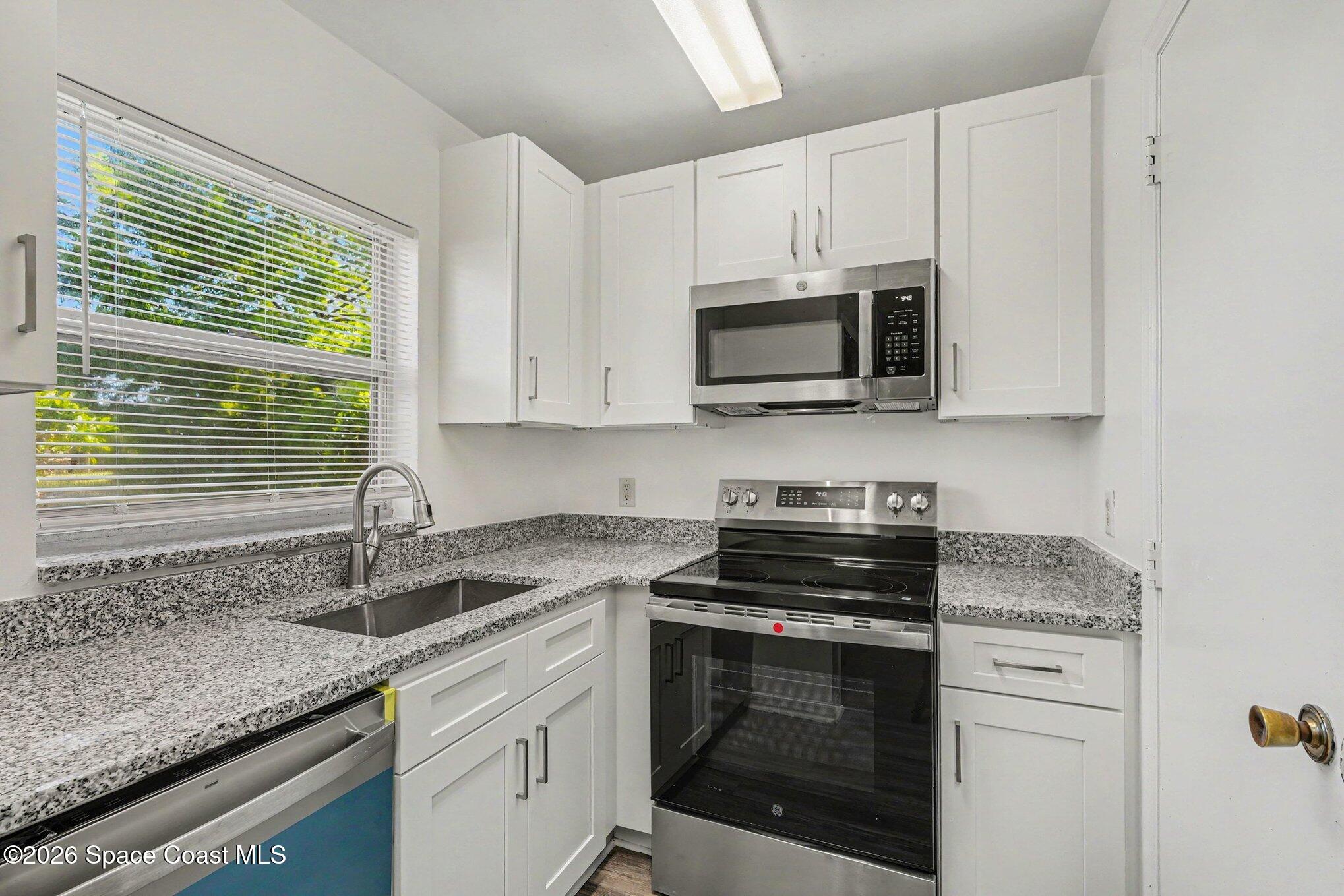 240 Spring Drive, Unit 2 Merritt Island, FL 32953 - Photo 6 of 16 006_file_7457