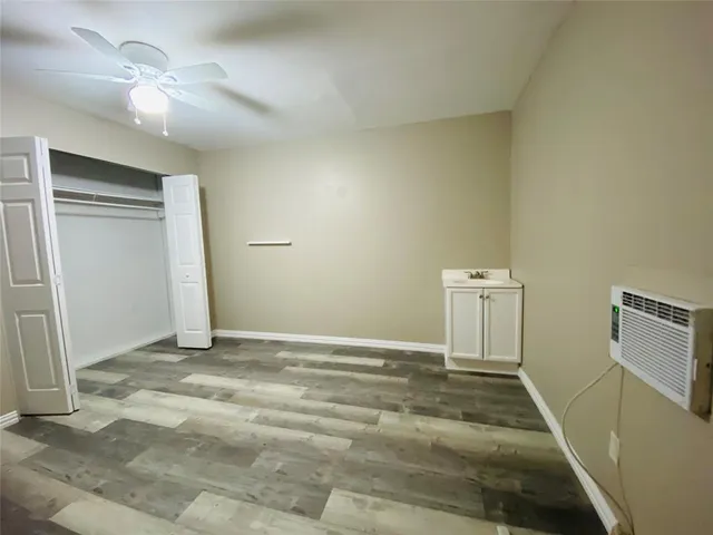 a bedroom with a bed and furniture