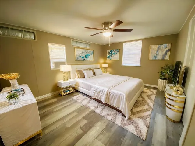 a view of room with window and ceiling fan