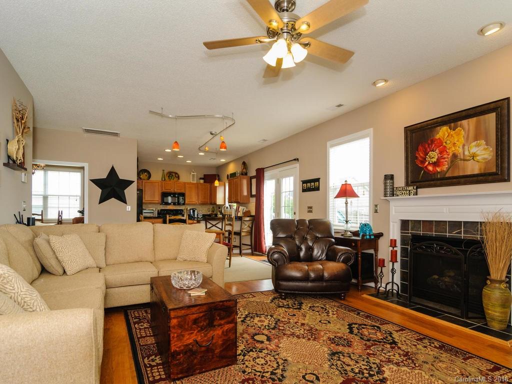 47 Lumber River Road, Unit 183 Fletcher, NC 28732 - Photo 3 of 24 a living room with furniture a fireplace and a flat screen tv