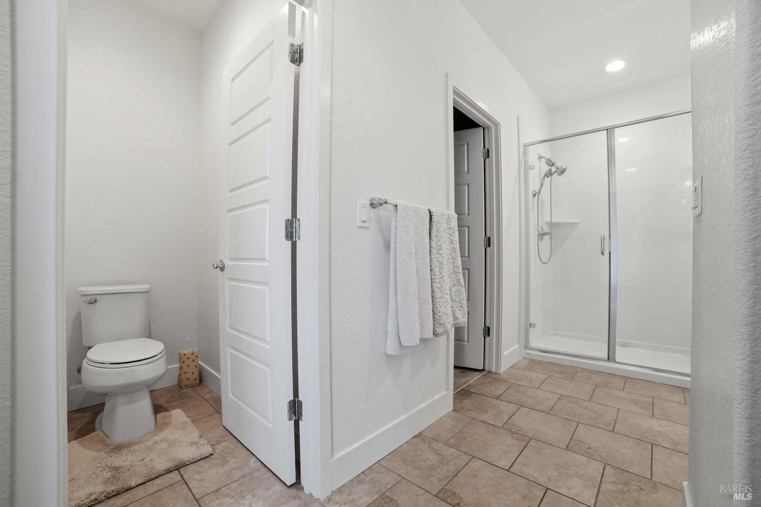 5305 Kirby Place Rohnert Park, CA 94928 - Photo 16 of 37 a bathroom with a granite countertop toilet and a shower