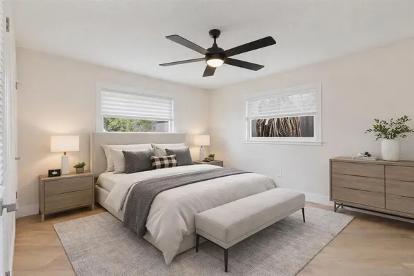 a bedroom with a bed and window