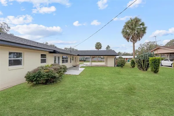 a view of a house with a back yard