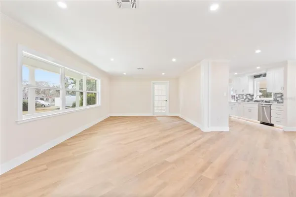 a view of an empty room with a window