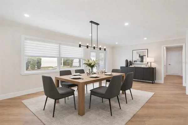 a view of a dining room with furniture window and outside view