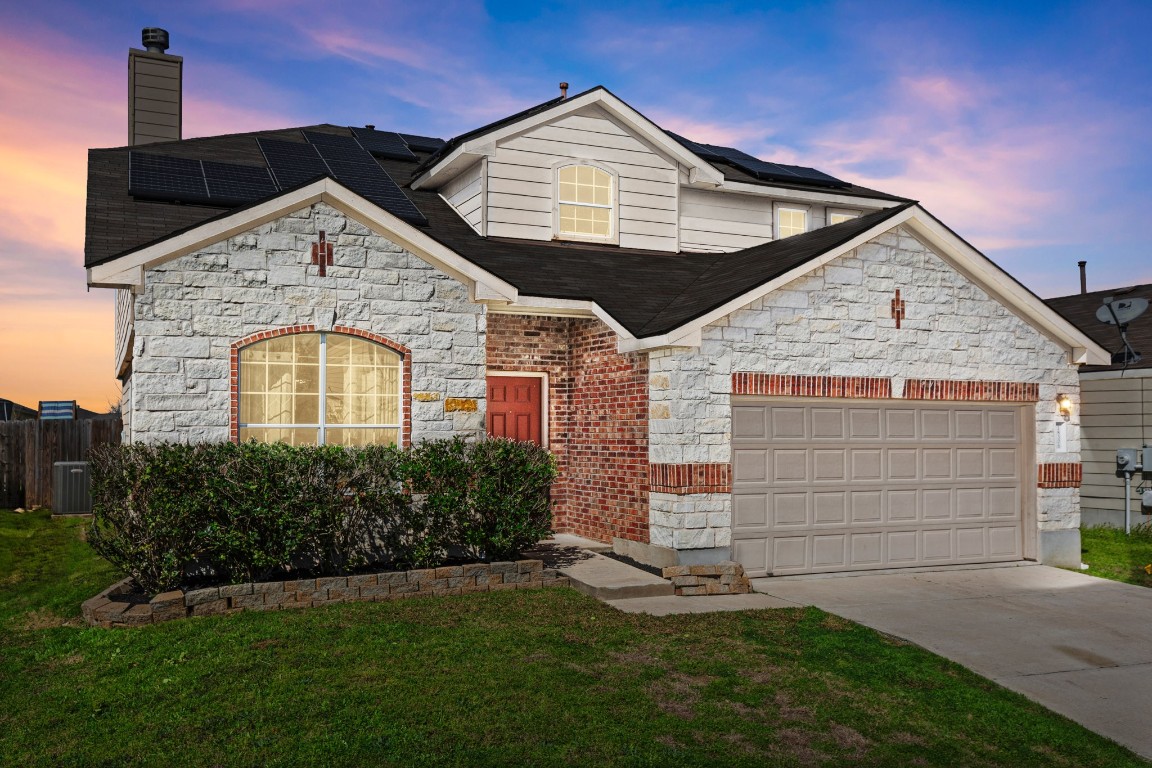 18306 Basket Flower Bend Elgin, TX 78621 - Photo 1 of 1 a view of a house with a small yard