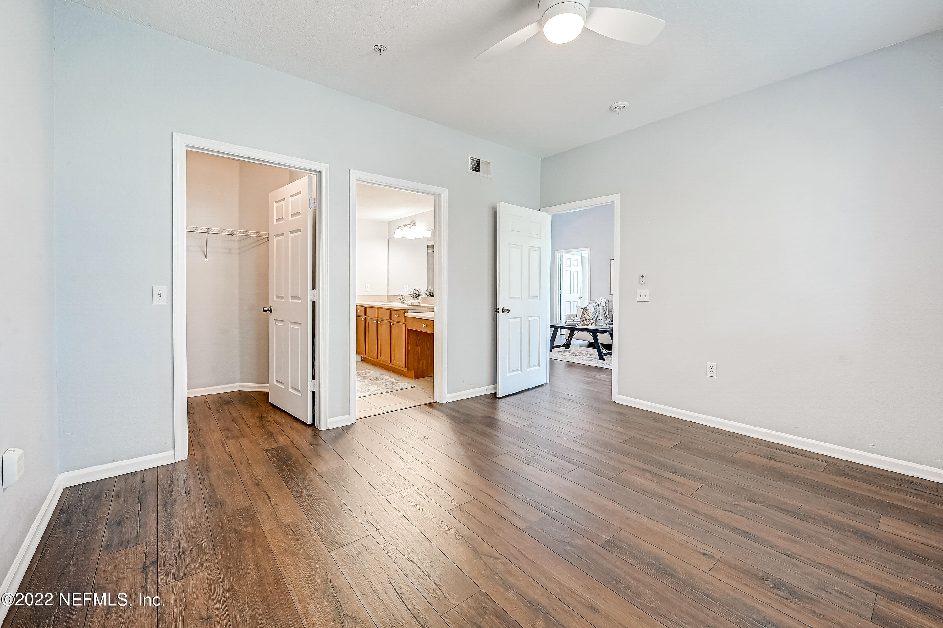 8550 Touchton Road, Unit 1132 Jacksonville, FL 32216 - Photo 14 of 43 a view of an empty room with window and wooden floor