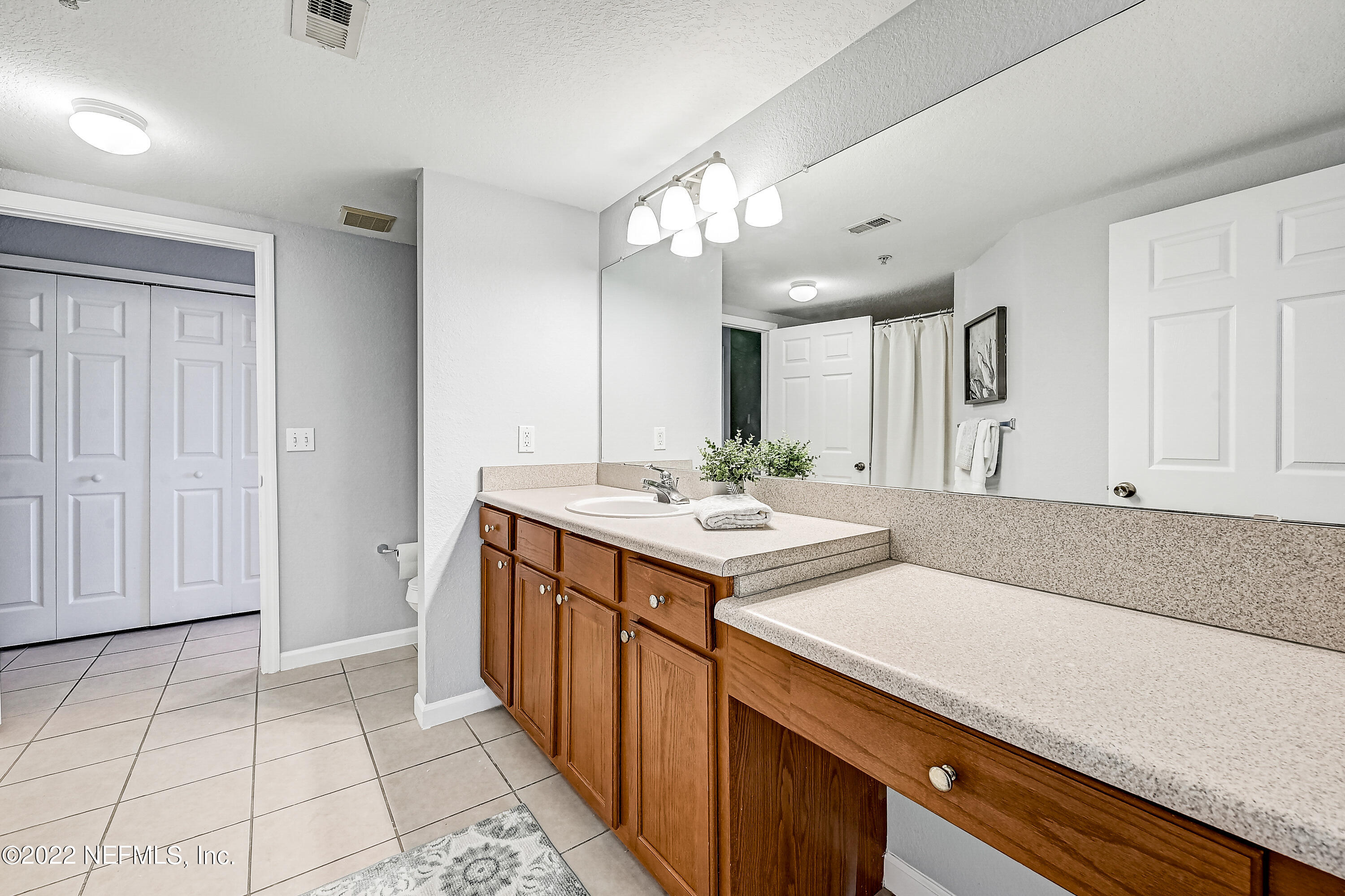 8550 Touchton Road, Unit 1132 Jacksonville, FL 32216 - Photo 15 of 43 a kitchen with a sink and cabinets