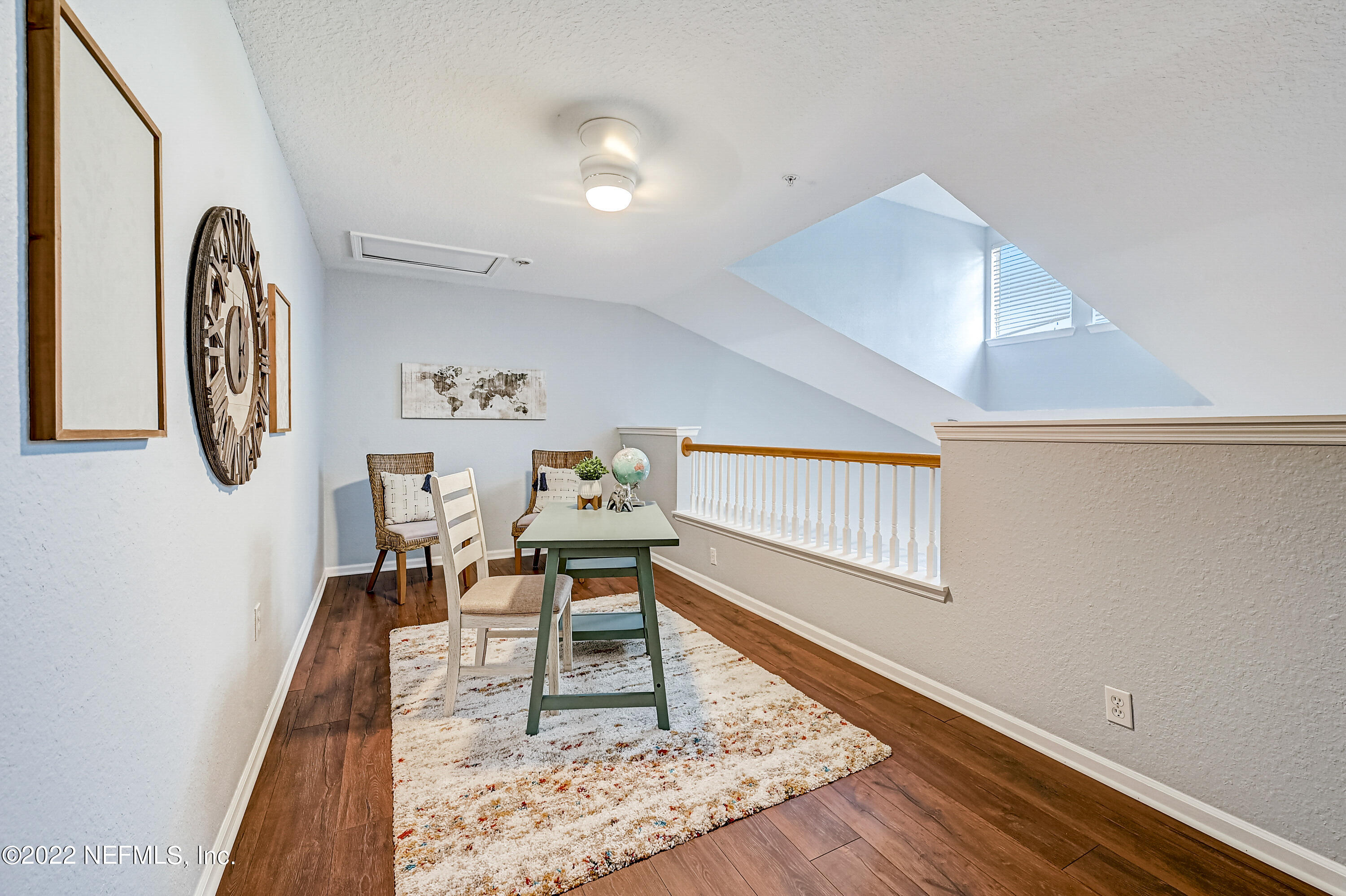 8550 Touchton Road, Unit 1132 Jacksonville, FL 32216 - Photo 17 of 43 a living room with furniture and a rug