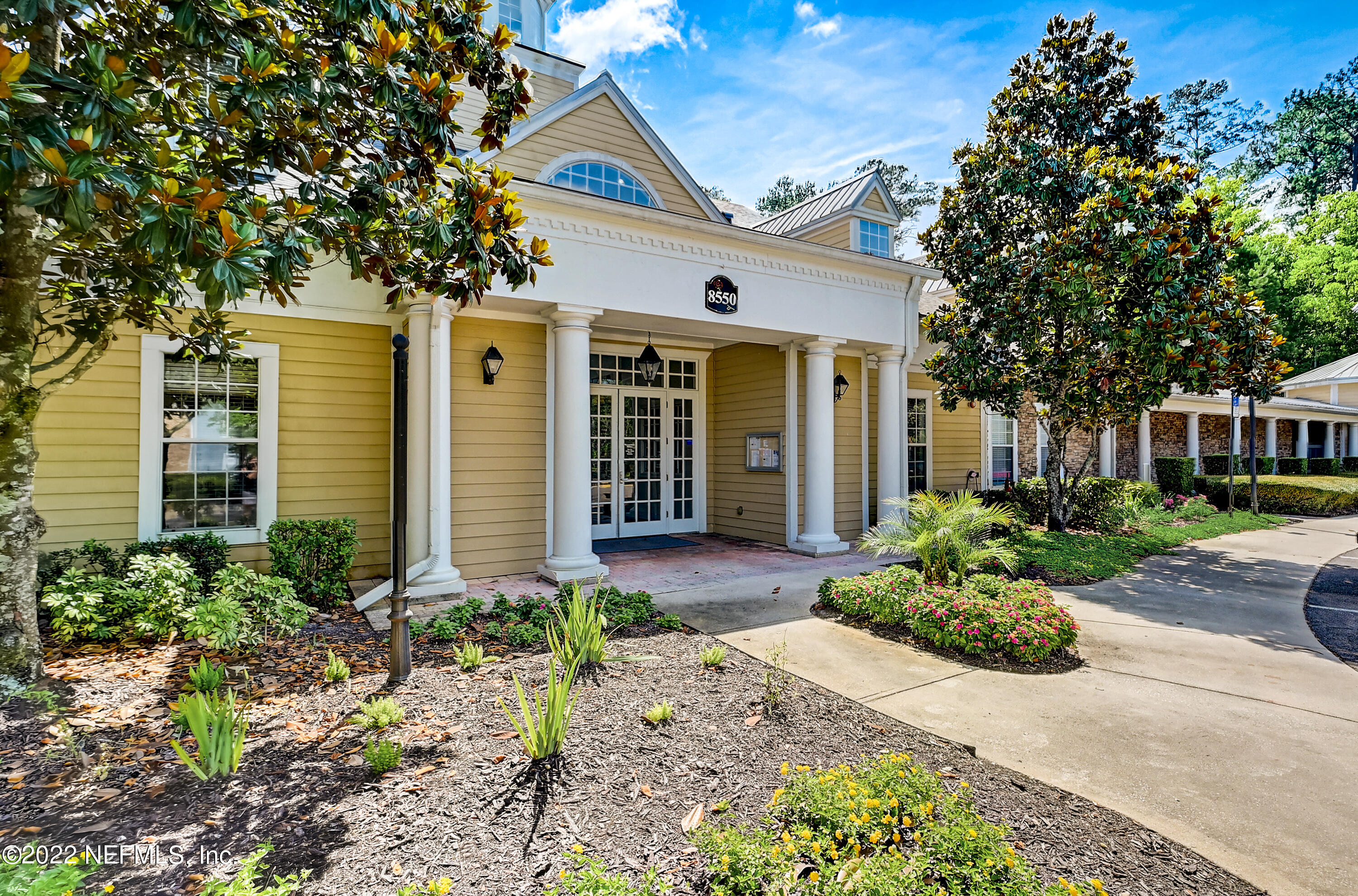 8550 Touchton Road, Unit 1132 Jacksonville, FL 32216 - Photo 31 of 43 a front view of a house with garden