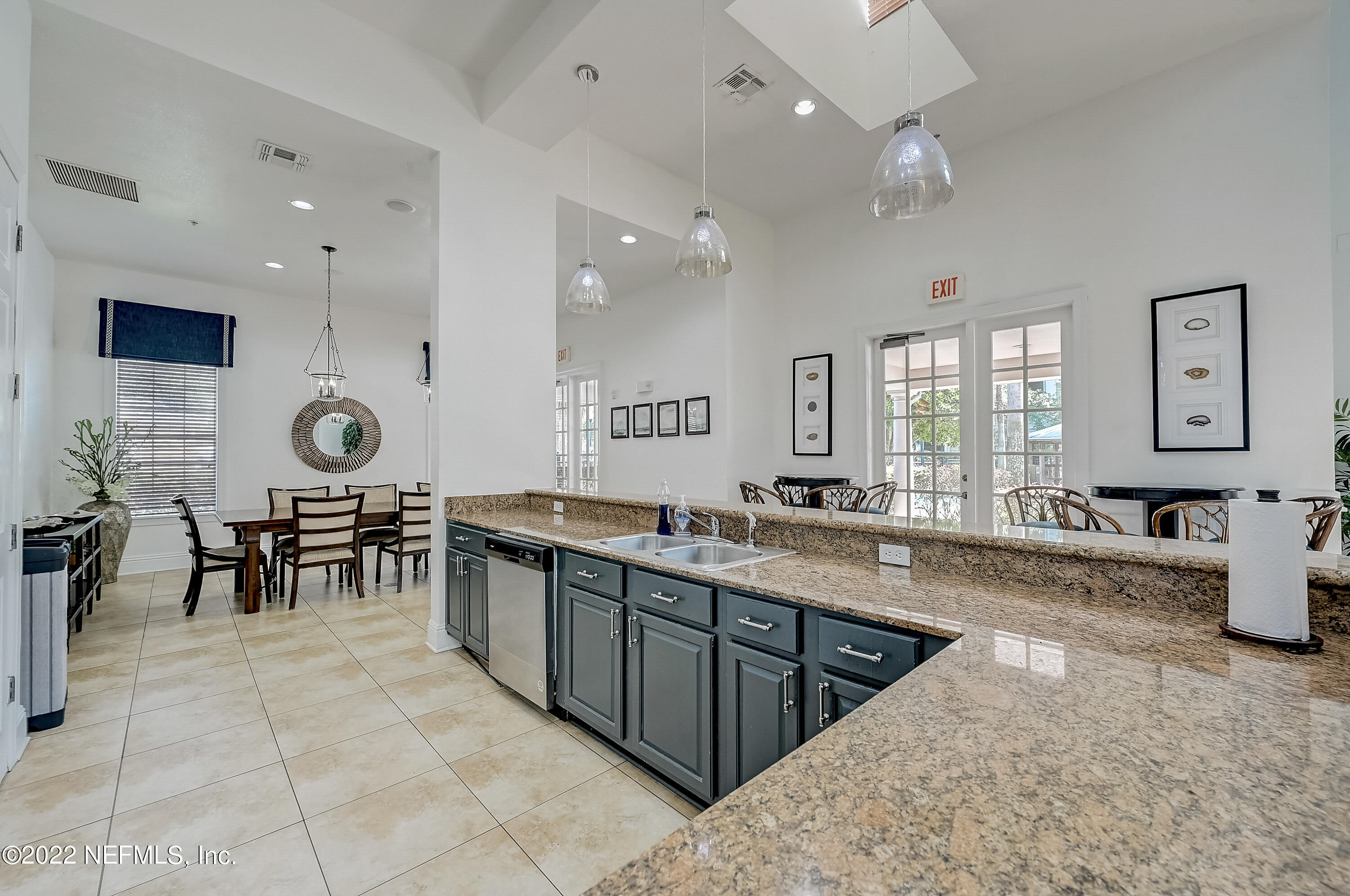 8550 Touchton Road, Unit 1132 Jacksonville, FL 32216 - Photo 32 of 43 a large kitchen with lots of counter top and stainless steel appliances