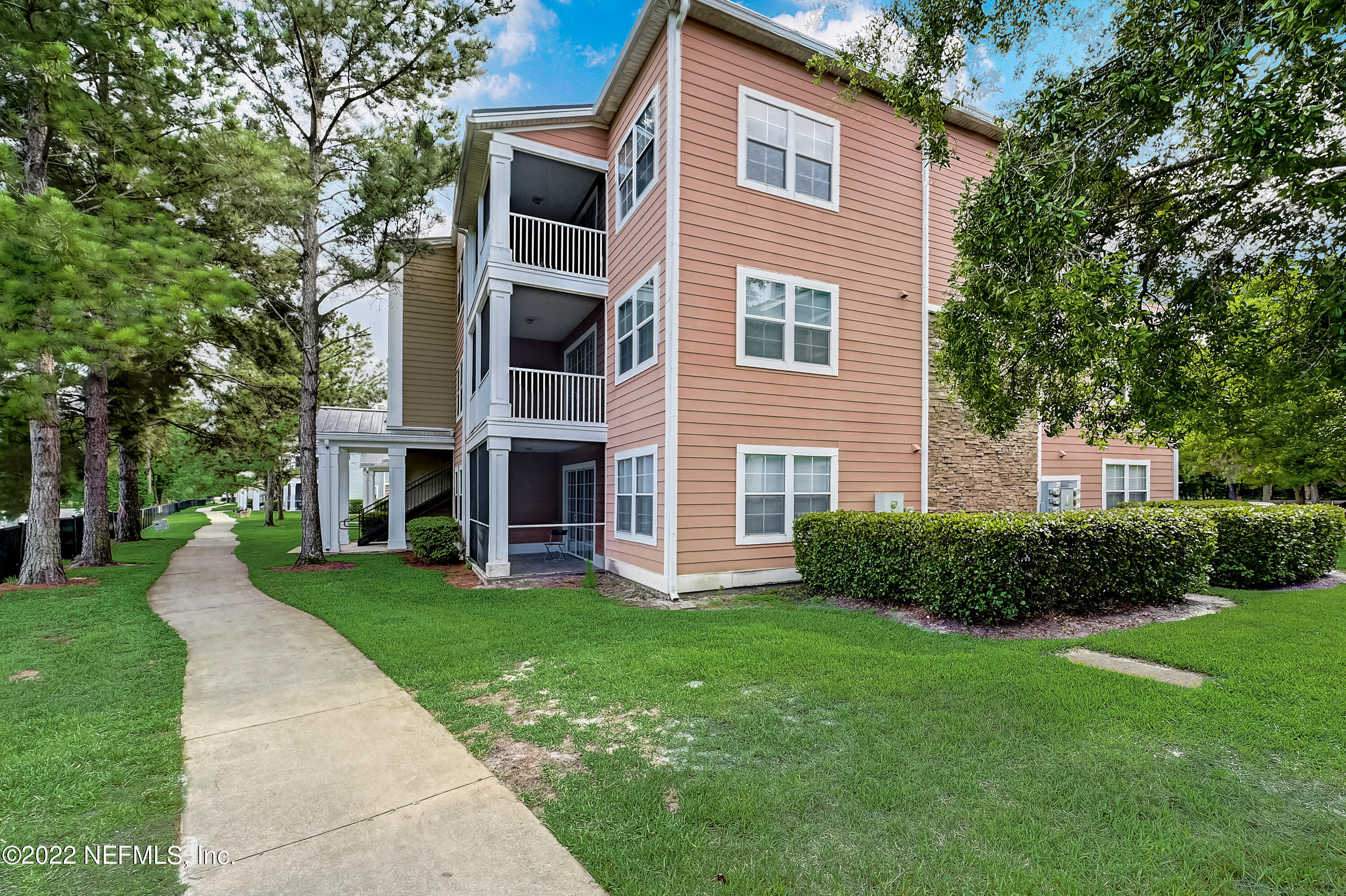 8550 Touchton Road, Unit 1132 Jacksonville, FL 32216 - Photo 36 of 43 a view of a house with a yard