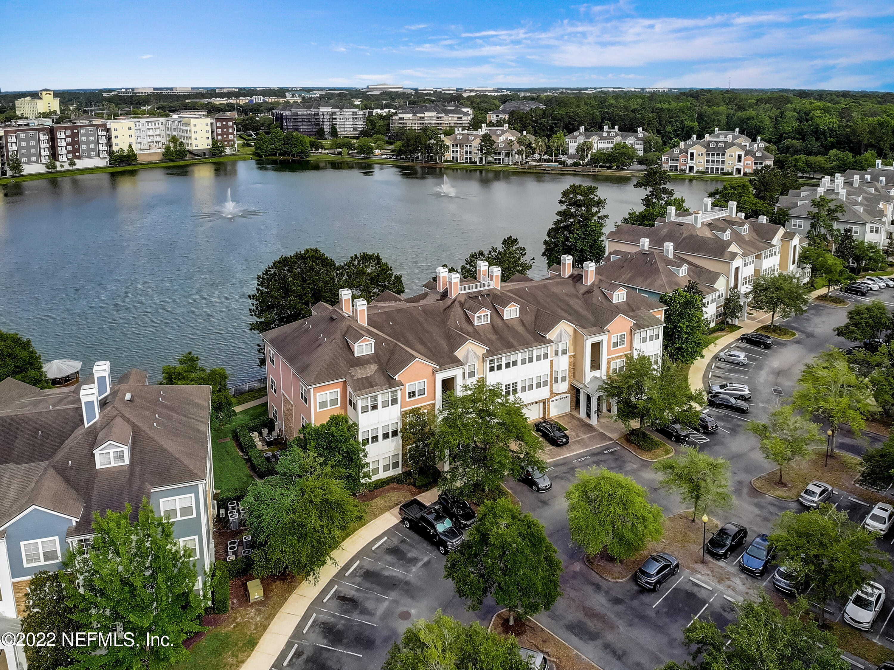 8550 Touchton Road, Unit 1132 Jacksonville, FL 32216 - Photo 37 of 43 an aerial view of city and lake with trees all around