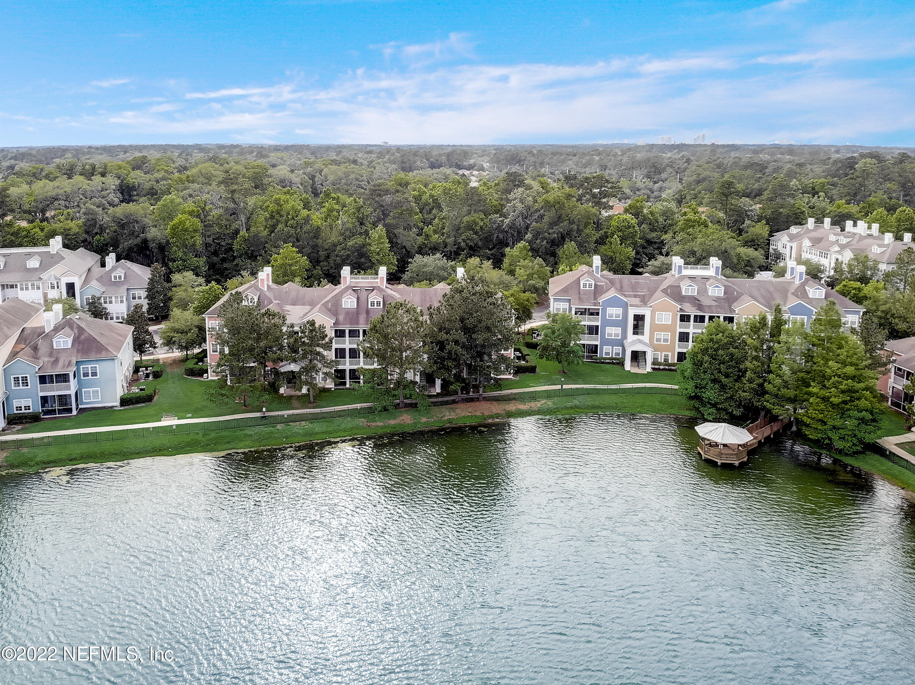 8550 Touchton Road, Unit 1132 Jacksonville, FL 32216 - Photo 38 of 43 an aerial view of a house with a garden and lake view