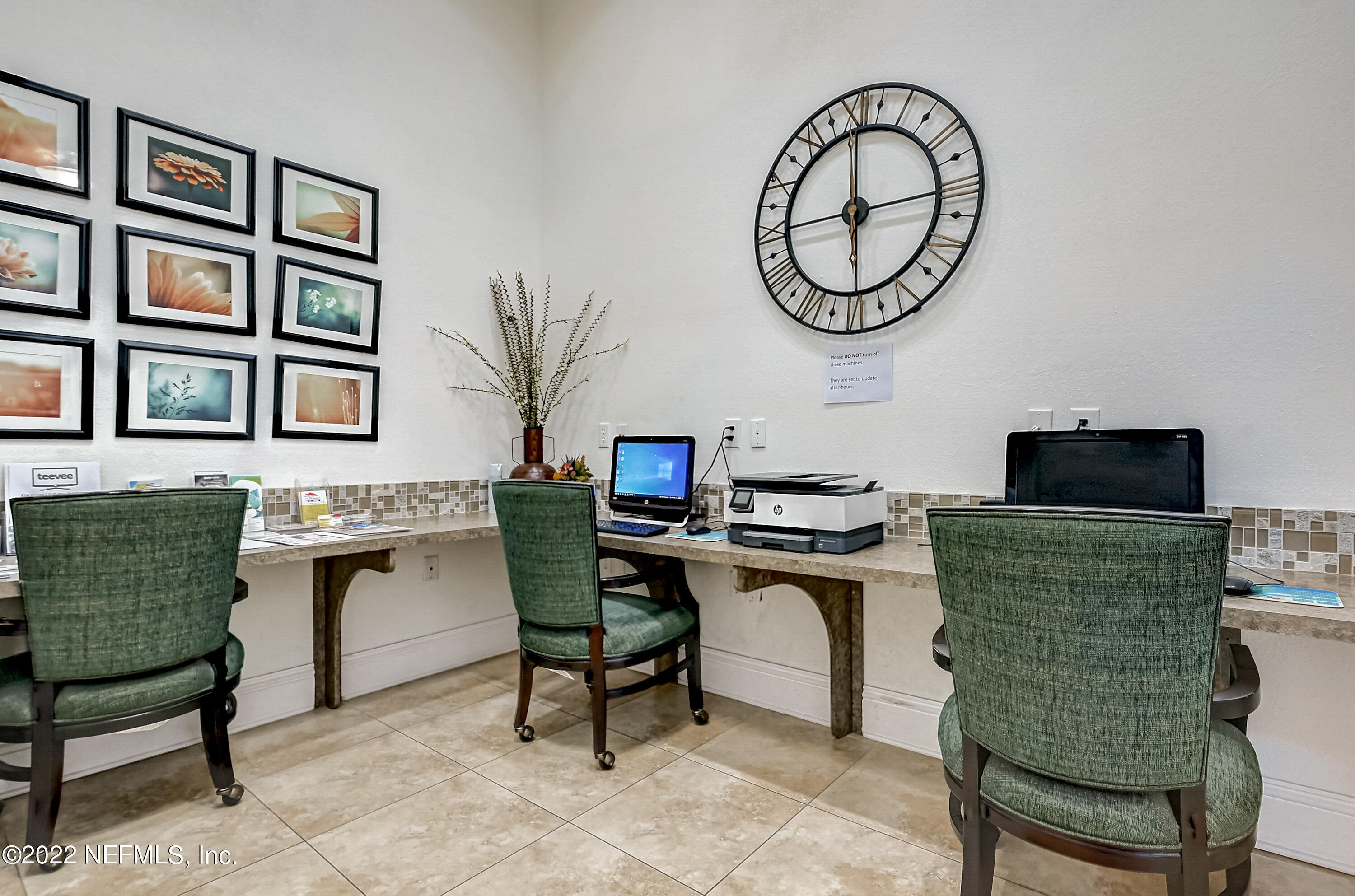 8550 Touchton Road, Unit 1132 Jacksonville, FL 32216 - Photo 40 of 43 a work room with furniture and a wooden floor
