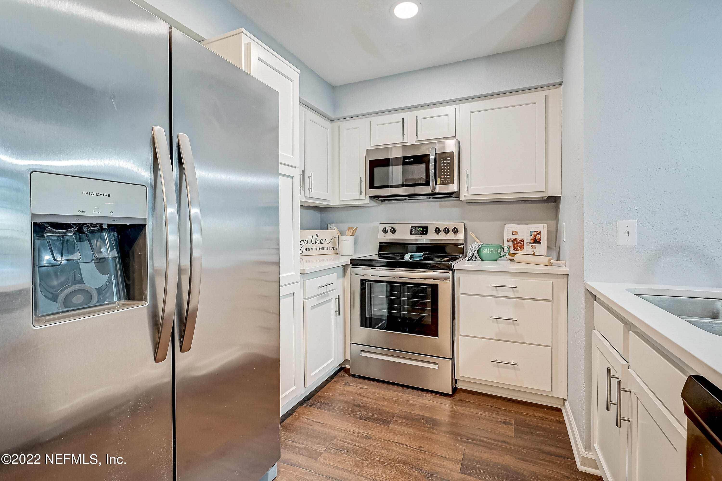 8550 Touchton Road, Unit 1132 Jacksonville, FL 32216 - Photo 5 of 43 a kitchen with stainless steel appliances cabinets a refrigerator and a stove