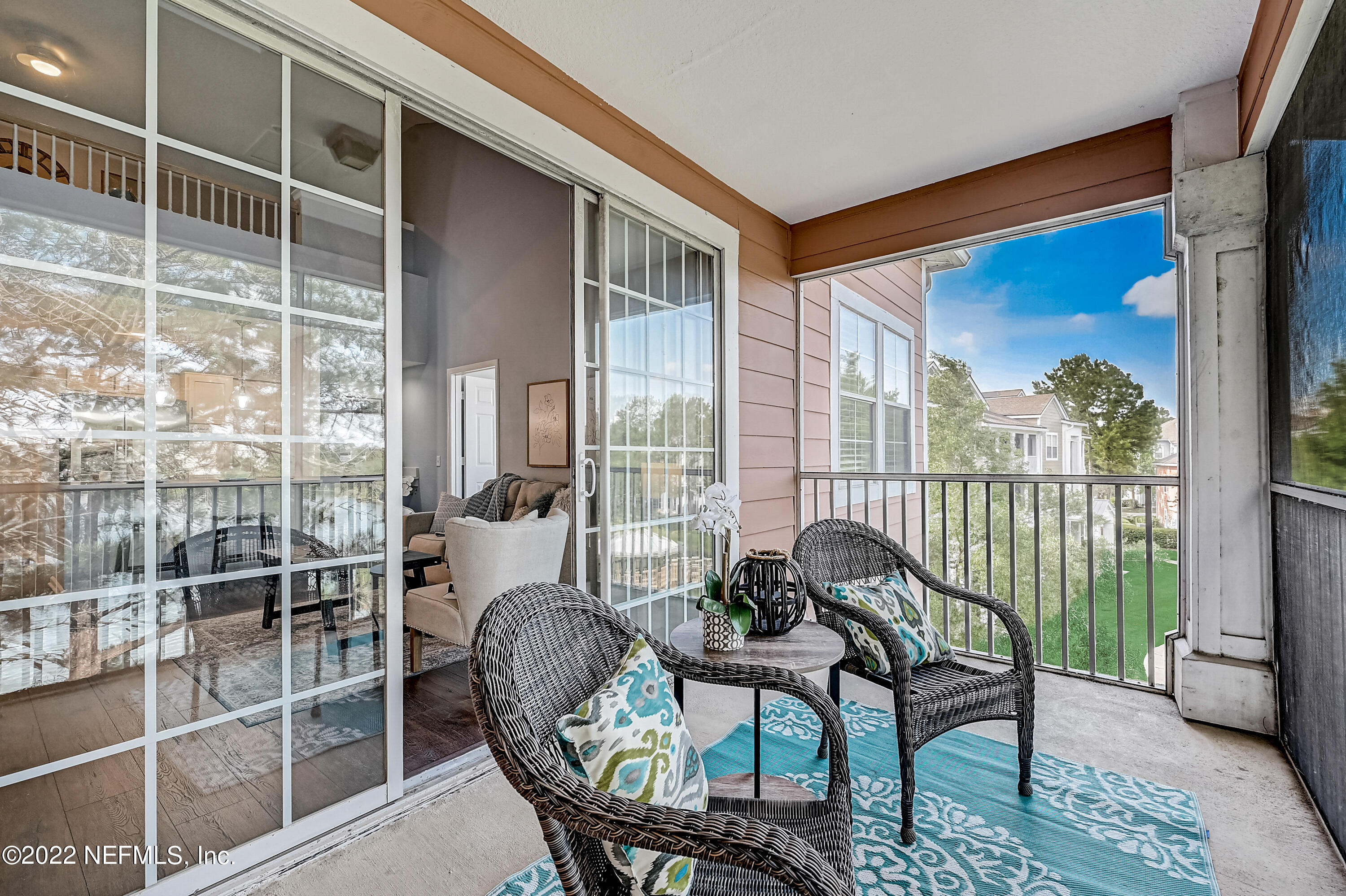 8550 Touchton Road, Unit 1132 Jacksonville, FL 32216 - Photo 8 of 43 a balcony with furniture and a potted plant