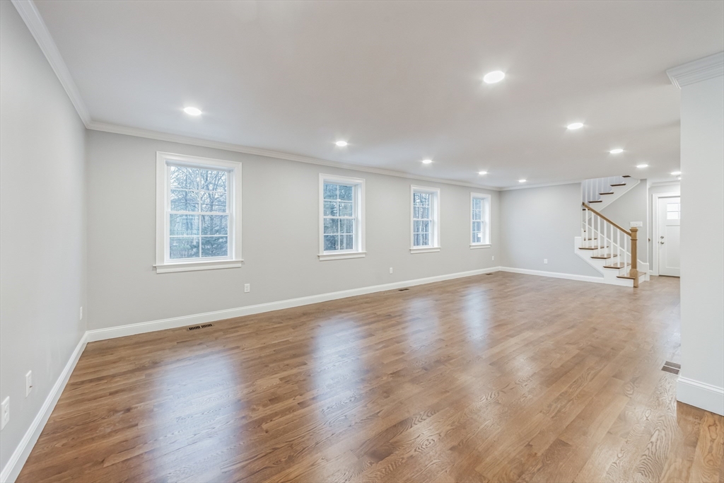36 Gove Road Billerica, MA 01821 - Photo 12 of 30 an empty room with wooden floor and windows
