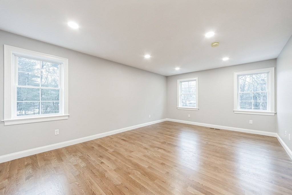 36 Gove Road Billerica, MA 01821 - Photo 19 of 30 a view of an empty room with wooden floor and a window
