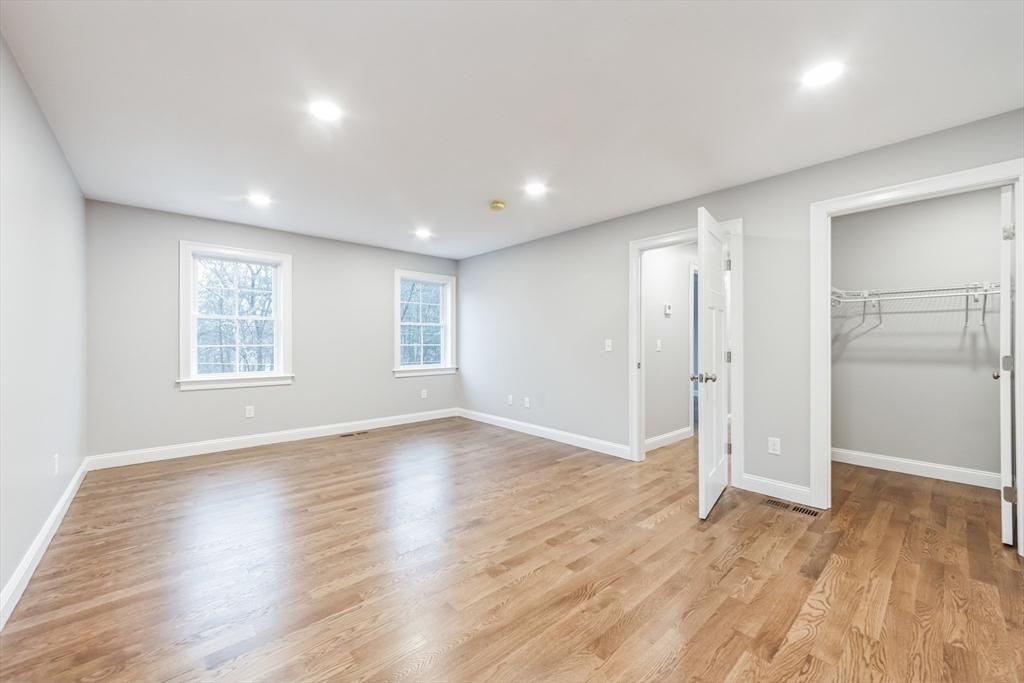 36 Gove Road Billerica, MA 01821 - Photo 20 of 30 an empty room with wooden floor closet and windows